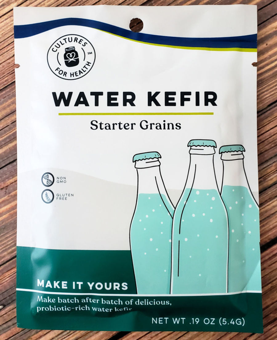 Packet of Cultures for Health Water Kefir Grains on wood table.