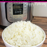 Jasmine rice served in a white ceramic bowl sitting next to an Instant Pot pressure cooker on a wood table.