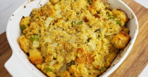 Gluten Free Stuffing in white casserole dish.