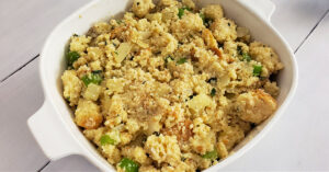 Uncooked gluten free stuffing in a baking dish.