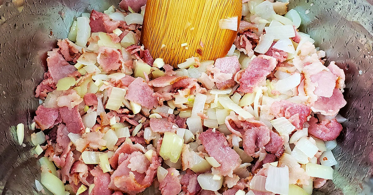 Bacon, onion and garlic cooking in Instant Pot.