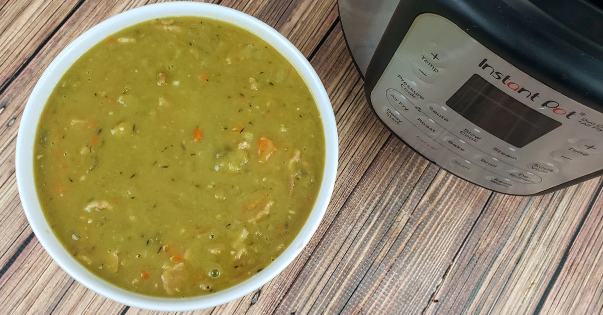 Split pea soup and Instant Pot on table.