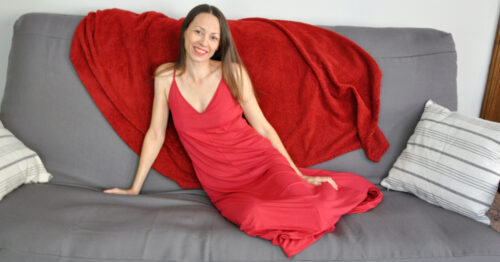 Chrystal lounging in Skivys Goddess Gown on futon.
