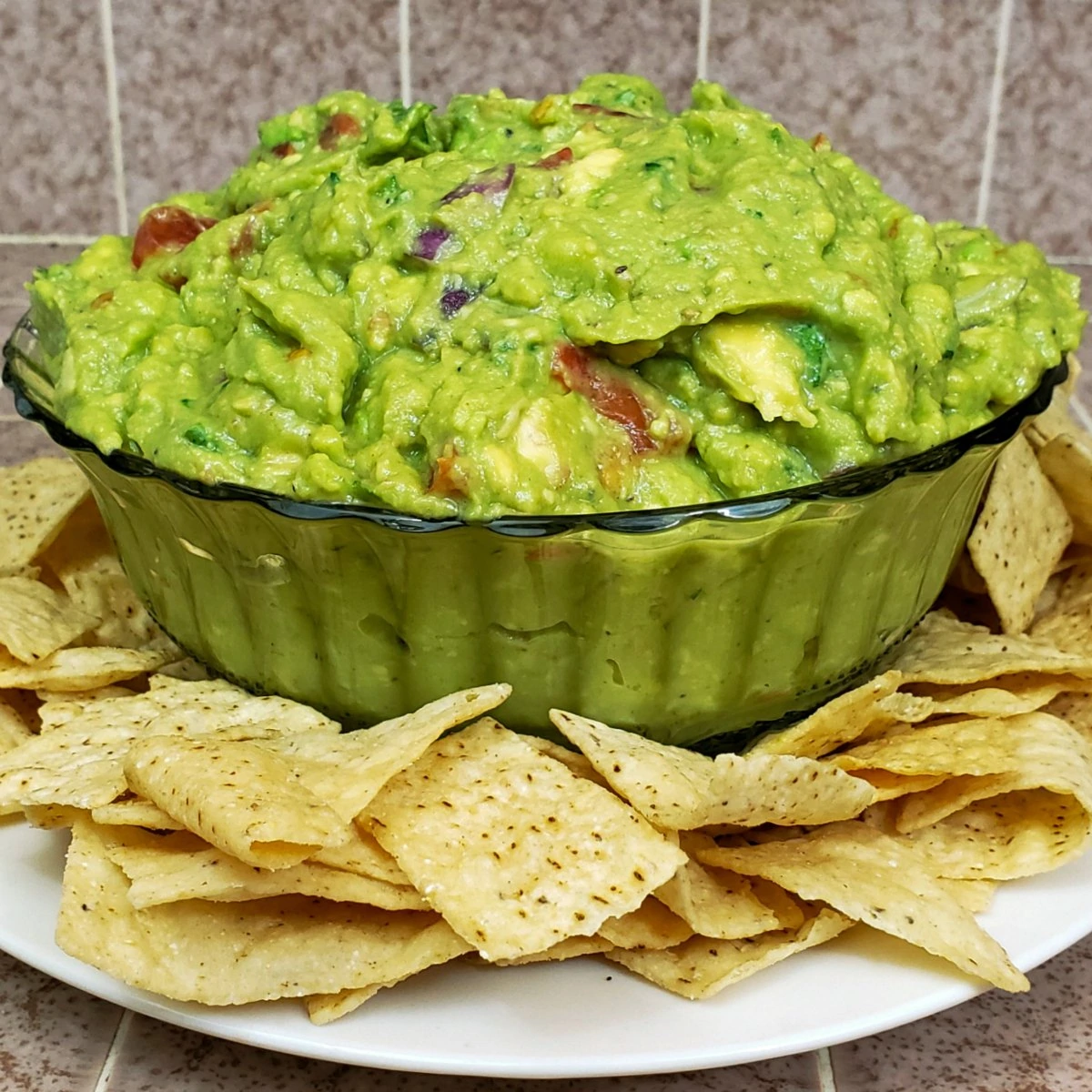 Homemade guacamole served with tortilla chips.