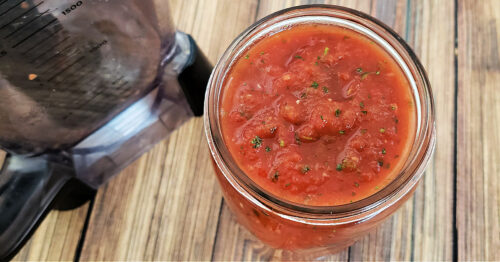Mexican salsa in mason jar near blender.