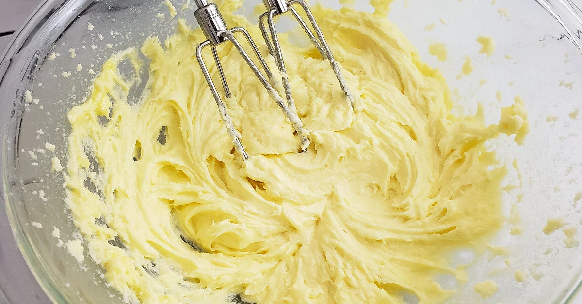 Eggs mixed into creamed sugar and butter.