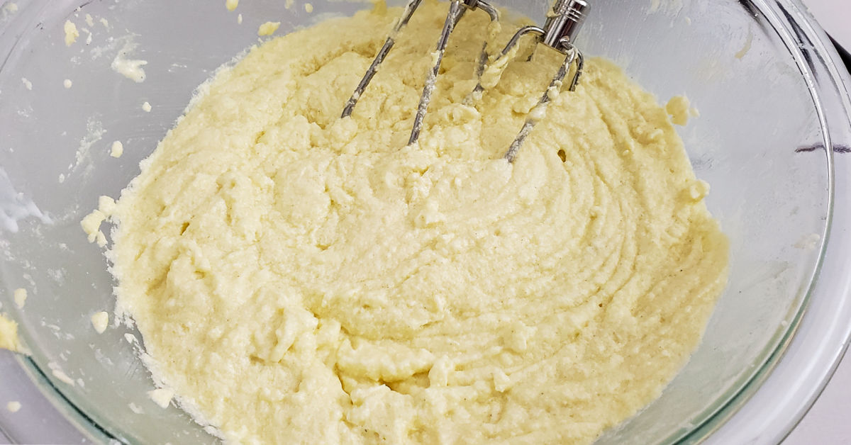 Buttermilk being mixed into muffin batter.