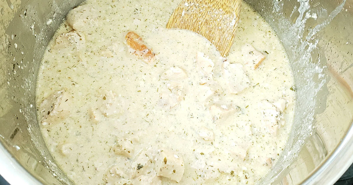 Cooked chicken and cream cheese mixture in Instant Pot.