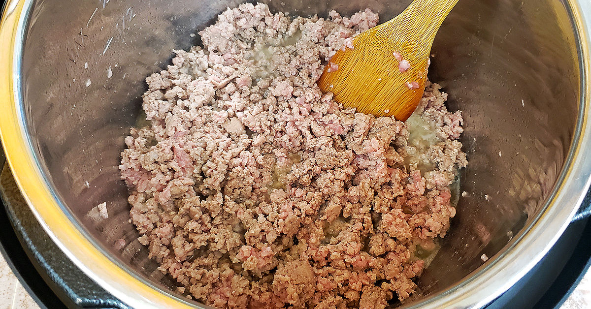 Ground sausage being browned in Instant Pot.