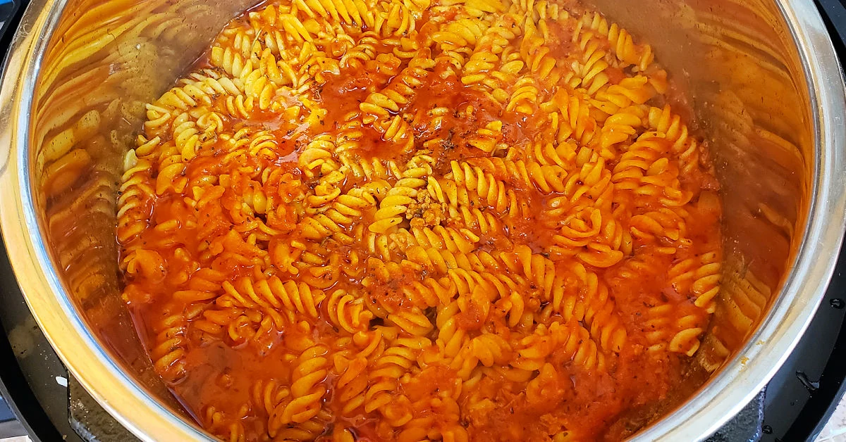 Cooked rotini with meat sauce in Instant Pot.