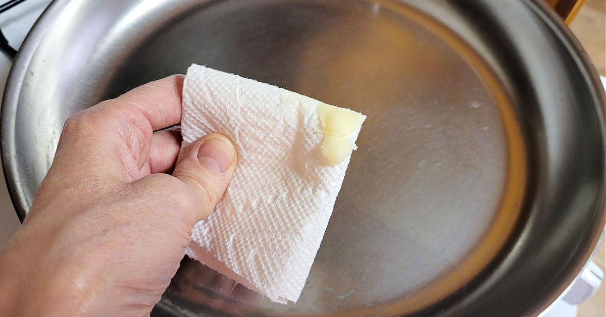 Seasoning wax on a folded up paper towel.