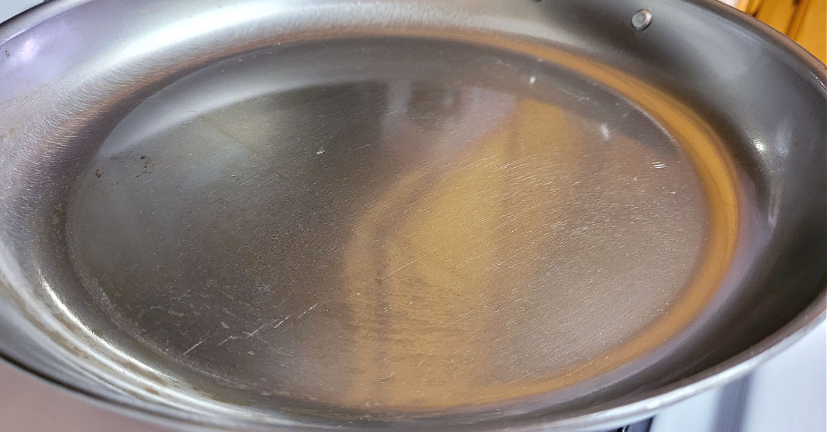 Carbon Steel Pan being heated with seasoning wax on it.