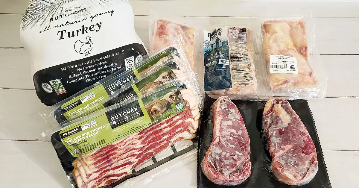 Shipment from ButcherBox that includes a whole turkey, 3 packs of bacon, 3 packs of chicken wings and 2 steaks.