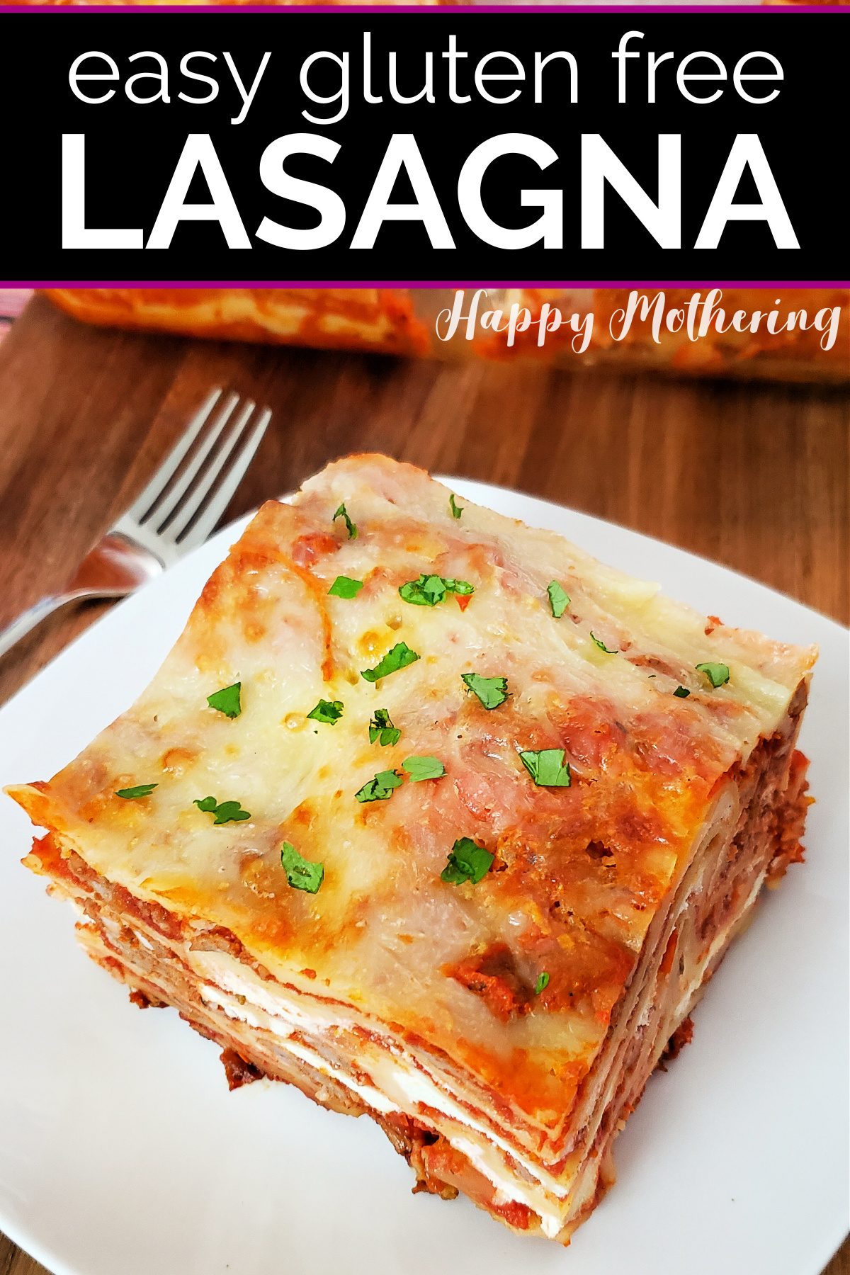 Square of homemade gluten free lasagna served on square white plate and garnished with parsley.