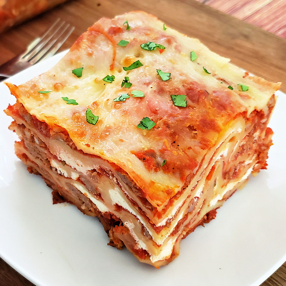 Close up of homemade gluten free lasagna so you can see the layers of ingredients.