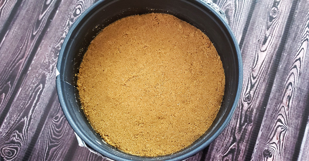 Cheesecake crust pressed into springform pan.