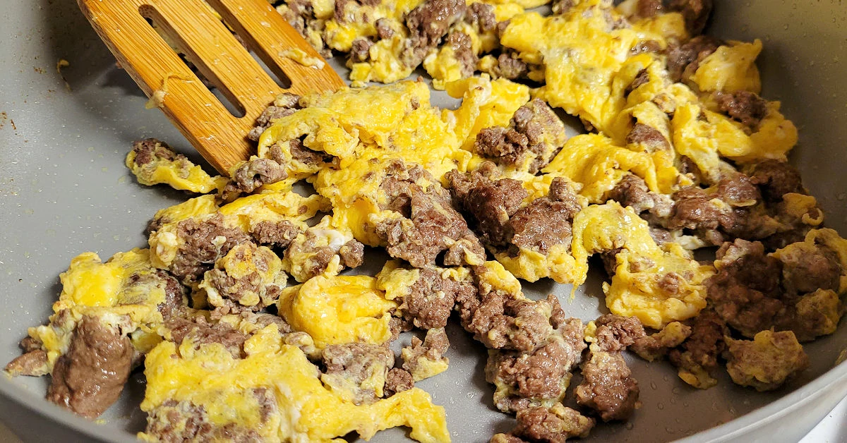 Ground beef and scrambled eggs cooking in a Fusion Guard by Masterchef nonstick frying pan.