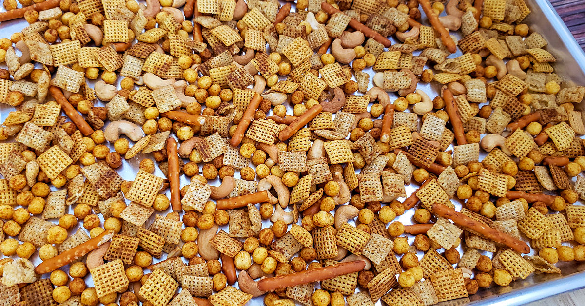 Baked Chex mix cooling after being baked in the oven.