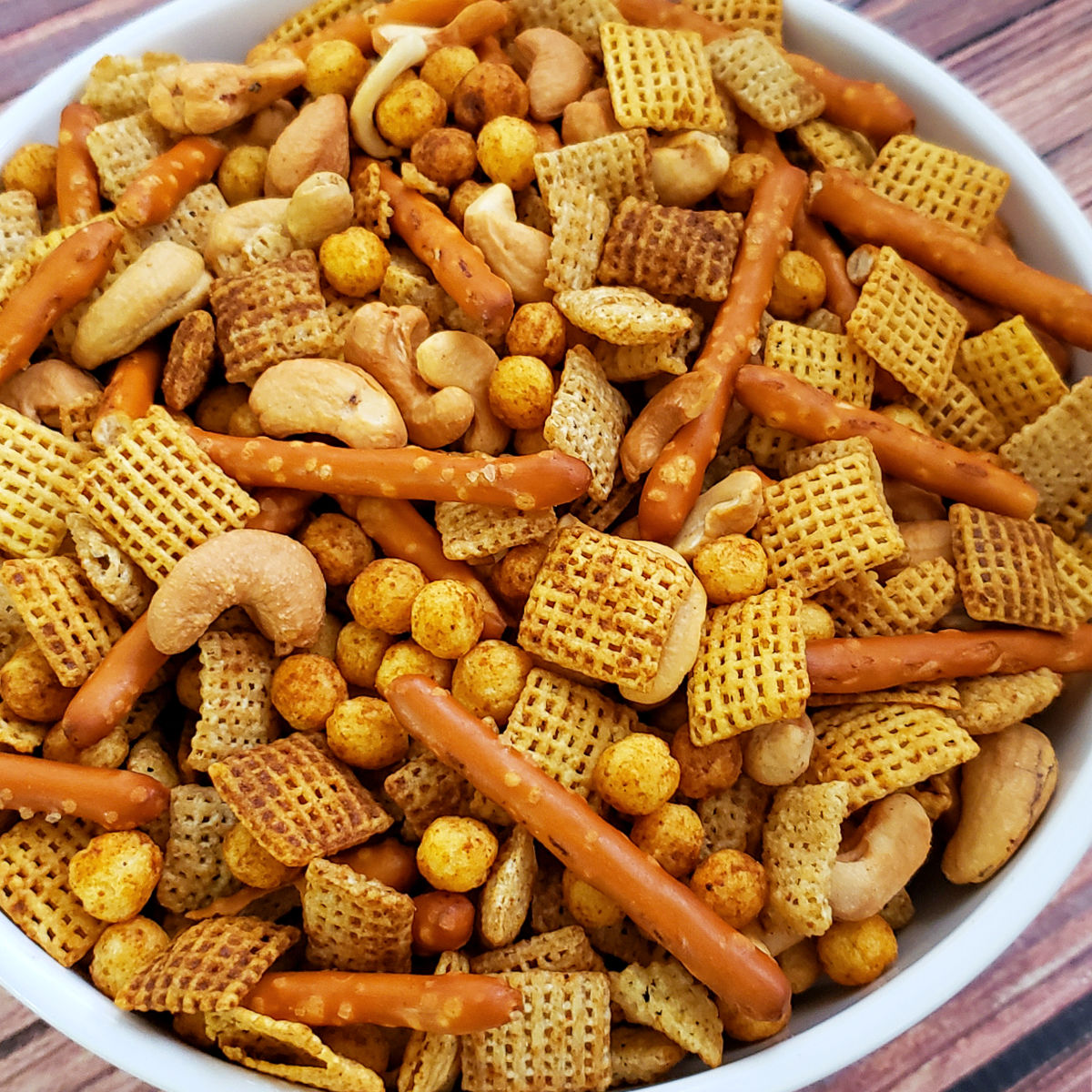 Close up of bowl of homemade Chex mix to serve at a party.