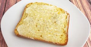 Mayo, sea salt and pepper on a slice of gluten free bread.