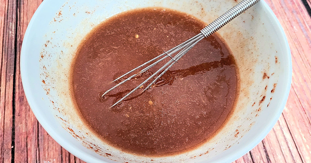 Cinnamon lemon mixture being whisked together in a small bowl.