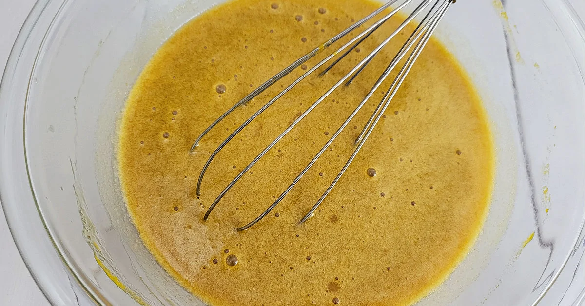 Pumpkin, butter and vanilla whisked into egg and sugar mixture.
