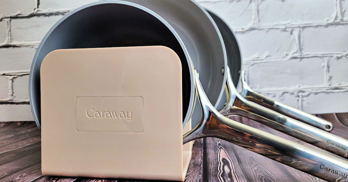 Cream colored Caraway Cookware set in a tan magnetic organizer.