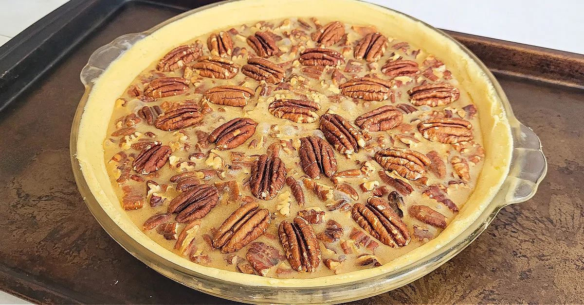 Pecan halves arranged on the top of a gluten free pecan pie.